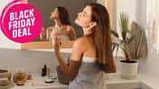 A,Beautiful,Young,Woman,Sprays,Perfume,On,Her,Neck,While