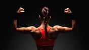Athletic,Young,Woman,Showing,Muscles,Of,The,Back,And,Hands