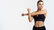 Determined,,Strong,And,Healthy,Sports,Woman,,Stretching,,Stretch,Her,Arms,