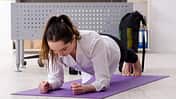 Female,Employee,Doing,Sport,Exercises,In,The,Office