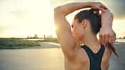 Athletic,Woman,Warming,Up,Before,A,Workout,Standing,Facing,The