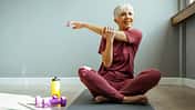 Mature woman doing stretching exercises