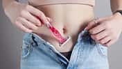 Young,Woman,Shaving,Belly,In,Room.