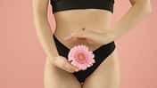 Gynecology.,Woman,In,Underwear,With,Gerbera,Flower,On,Pink,Background,
