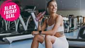 Young,Strong,Sporty,Athletic,Sportswoman,Woman,In,White,Sportswear,Earphones