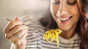 Young,Woman,Enjoys,Eating,Spaghetti.,He,Has,Aglio,E,Olio