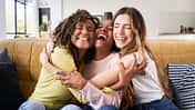 Three,Happy,Friends,Hugging,Smiling.funny,Women,Together,Celebrating,Sitting,On