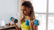 Blue,Barbells.,Close,Up,Of,Young,Dark-eyed,Sportswoman,With,Nice