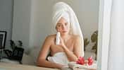 Charming,Woman,In,White,Towel,Turban,Sitting,At,Table,With