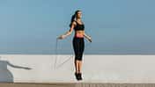 Young woman training with a jumping rope