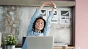 Asian,Businesswoman,Stretching,Body,For,Relaxing,While,Working,With,Laptop