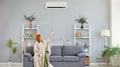 Girl,Wrapped,In,Blanket,Switching,On,,Off,Air,Conditioner,,Blowing