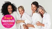 Vier Frauen im Alter der Wechseljahre lachen und sind glücklich
