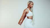 African,American,Fitness,Woman,Stretching,Her,Arms,During,Workout.,Fit