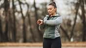 Woman Checking Fitness Tracker Outdoor Early Morning